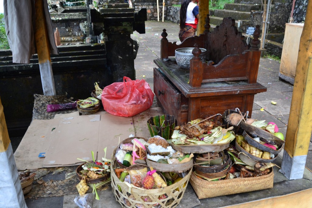 Chickens, rice and other foods set as offerings on one of the temples